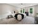 Relaxing bedroom with large windows, plush carpeting, and stylish decor at 384 Speedway Pl, Concord, NC 28027