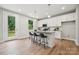 Contemporary kitchen boasts granite countertops, stainless steel appliances, and a convenient breakfast bar at 384 Speedway Pl, Concord, NC 28027