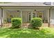 Covered back porch with brick and column accents, perfect for relaxing and enjoying the view at 4025 Cherrybrook Dr, Mint Hill, NC 28227