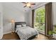 Bright bedroom with a large arched window providing ample natural light and a scenic view at 4025 Cherrybrook Dr, Mint Hill, NC 28227