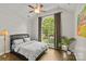 Bright bedroom with a large arched window providing ample natural light and a scenic view at 4025 Cherrybrook Dr, Mint Hill, NC 28227
