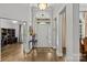 Bright foyer showcasing hardwood floors, high ceilings, and an elegant entryway at 4025 Cherrybrook Dr, Mint Hill, NC 28227