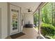 Charming front porch with tile flooring and covered seating area, a welcoming entrance to the home at 4025 Cherrybrook Dr, Mint Hill, NC 28227