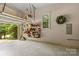 Clean garage featuring an open door, organized shelving, and an attached garage door opener at 4025 Cherrybrook Dr, Mint Hill, NC 28227
