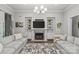 Cozy living room with a stone fireplace, built-in shelving, and plush seating for relaxation at 4025 Cherrybrook Dr, Mint Hill, NC 28227