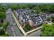 Aerial view of new townhome community with sidewalks and landscaping, close to shops and local businesses at 4121 Selwyn Walk Ct, Charlotte, NC 28209