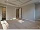 Large bedroom with hardwood flooring, recessed lighting and access to the bathroom at 4121 Selwyn Walk Ct, Charlotte, NC 28209