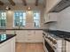 This spacious kitchen features stainless steel appliances, custom cabinets, and an oversized island at 4121 Selwyn Walk Ct, Charlotte, NC 28209