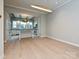 Open-concept living space connects to a modern kitchen, hardwood floors, and recessed lighting at 4121 Selwyn Walk Ct, Charlotte, NC 28209