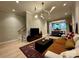 Cozy living room with hardwood floors, modern lighting, and comfortable seating area at 4121 Selwyn Walk Ct, Charlotte, NC 28209