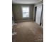 Bedroom featuring carpet, a sliding door closet, and a window for natural light at 423 Tot Dellinger Rd, Cherryville, NC 28021