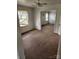 Spacious living room with original hardwood floors, and an open floor plan at 423 Tot Dellinger Rd, Cherryville, NC 28021