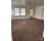 Living room with hardwood floors, plenty of natural light, and access to an exterior door at 423 Tot Dellinger Rd, Cherryville, NC 28021