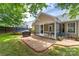 Inviting backyard with a screened-in porch, patio, and fenced yard at 4321 Timberwood Dr, Gastonia, NC 28056