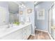 Bathroom featuring double sinks, wood flooring, a shower, and natural light at 4321 Timberwood Dr, Gastonia, NC 28056