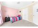 Bedroom with pink and yellow walls, neutral carpet, and a full bed at 4321 Timberwood Dr, Gastonia, NC 28056