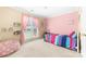 Colorful bedroom with pink walls, polka dot beanbag, and large window with pink curtains at 4321 Timberwood Dr, Gastonia, NC 28056