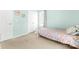 Bedroom featuring neutral carpet, pale green walls, and a floral-patterned bed at 4321 Timberwood Dr, Gastonia, NC 28056