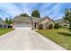 Charming single-story home with a well-manicured lawn and a two-car garage at 4321 Timberwood Dr, Gastonia, NC 28056