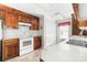 Well-lit kitchen featuring white countertops and wood cabinets with tile flooring at 4321 Timberwood Dr, Gastonia, NC 28056