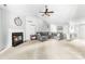 Bright living room featuring a fireplace, vaulted ceiling, and ample seating at 4321 Timberwood Dr, Gastonia, NC 28056