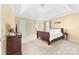 Serene main bedroom with a tray ceiling, carpeted floors, and ample natural light at 4321 Timberwood Dr, Gastonia, NC 28056
