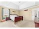 Comfortable main bedroom with a tray ceiling, carpet flooring and a relaxing ambiance at 4321 Timberwood Dr, Gastonia, NC 28056
