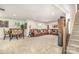 Finished basement offers a large living area, dining set, and additional seating at 4386 Oldstone Dr, Harrisburg, NC 28075