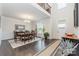 Elegant dining room featuring hardwood floors, a chandelier, and plenty of natural light at 4386 Oldstone Dr, Harrisburg, NC 28075