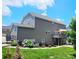 Back of home featuring an outdoor deck, manicured landscaping, and a lush green lawn at 4386 Oldstone Dr, Harrisburg, NC 28075