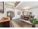 Welcoming foyer featuring dark hardwood floors and access to the formal dining room at 4386 Oldstone Dr, Harrisburg, NC 28075