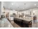 Spacious kitchen featuring granite countertops, a large island, and stainless steel appliances at 4386 Oldstone Dr, Harrisburg, NC 28075