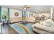 Open-concept living room flows seamlessly into the kitchen and dining areas for easy entertaining at 4386 Oldstone Dr, Harrisburg, NC 28075