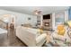 Inviting living room with a stone fireplace, comfortable seating, and a ceiling fan at 4386 Oldstone Dr, Harrisburg, NC 28075