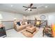 Comfortable loft area with plush seating, ceiling fan, and access to additional rooms at 4386 Oldstone Dr, Harrisburg, NC 28075