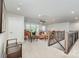 Bright loft area with comfortable seating, neutral carpeting, and recessed lighting at 4386 Oldstone Dr, Harrisburg, NC 28075