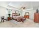 Well-lit main bedroom with tray ceilings, soft carpeting, and ample space at 4386 Oldstone Dr, Harrisburg, NC 28075