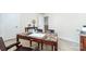 Home office features a granite table, and natural light at 4386 Oldstone Dr, Harrisburg, NC 28075