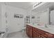 Bathroom with double sinks, shower and dark wood cabinets at 5009 Granite Creek Ln, Charlotte, NC 28269