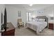 Bedroom featuring neutral carpet, TV and minimalist decor art at 5009 Granite Creek Ln, Charlotte, NC 28269