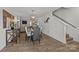 Well-lit dining room with modern furnishings and hardwood floors at 5009 Granite Creek Ln, Charlotte, NC 28269
