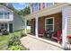 Charming front porch with stone accents and cozy seating, perfect for enjoying the outdoors and neighborhood views at 5009 Granite Creek Ln, Charlotte, NC 28269