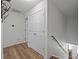 Hallway with light hardwood flooring, staircase, and access to other rooms at 5009 Granite Creek Ln, Charlotte, NC 28269