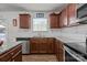 The beautiful kitchen features a stainless steel dishwasher and granite countertops at 5009 Granite Creek Ln, Charlotte, NC 28269