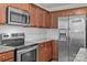 This kitchen features stainless steel appliances and beautiful granite countertops at 5009 Granite Creek Ln, Charlotte, NC 28269