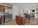 Open kitchen with a stainless steel refrigerator and center island at 5009 Granite Creek Ln, Charlotte, NC 28269