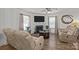 Inviting living room with a fireplace and plenty of natural light, creating a warm and welcoming atmosphere for relaxing at 5009 Granite Creek Ln, Charlotte, NC 28269