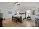 Primary bedroom with a ceiling fan, and hardwood floors at 5009 Granite Creek Ln, Charlotte, NC 28269
