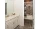 Bright bathroom featuring a modern vanity with stone countertops and a walk-in tiled shower at 5332 Pembrey Dr, Denver, NC 28037
