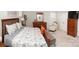 Spacious bedroom with a wooden bed frame, furniture set, and comfortable chair at 5332 Pembrey Dr, Denver, NC 28037